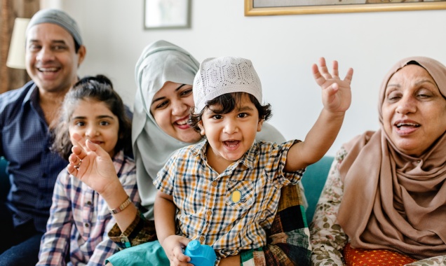 Young Muslim family with excited children