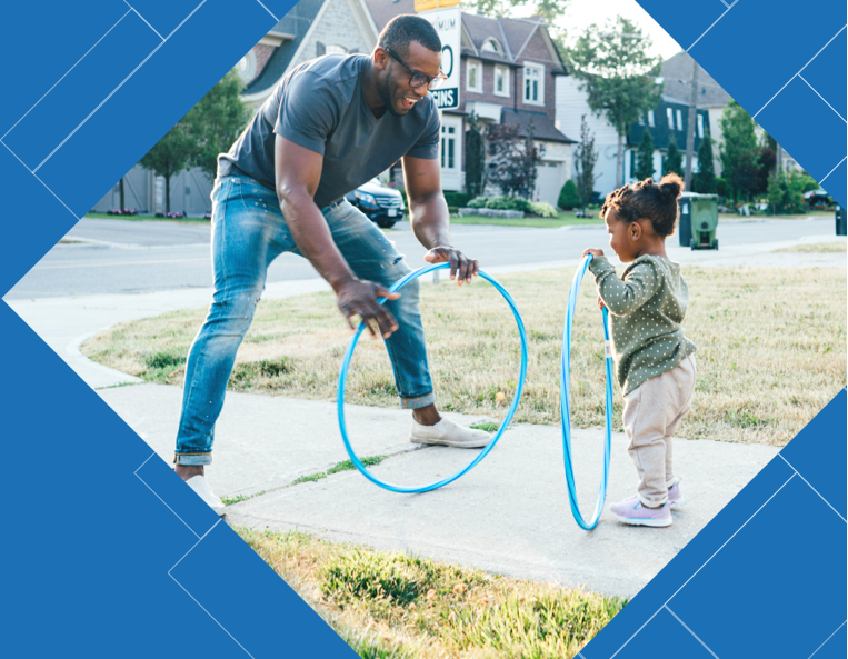 Father with daughter and hoola-hoops.