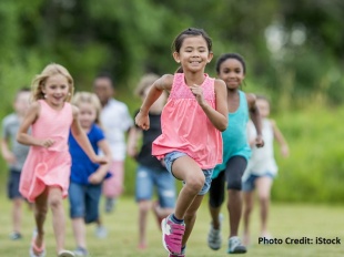 Children running through a field