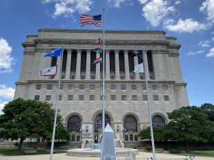 Milwaukee County courthouse, flying LGBTQ+ Rainbow flag and Pan-African flag