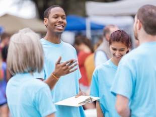 Four volunteers at a community event