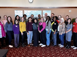 Group photo of about 30 people during the narrative infrastructure retreat
